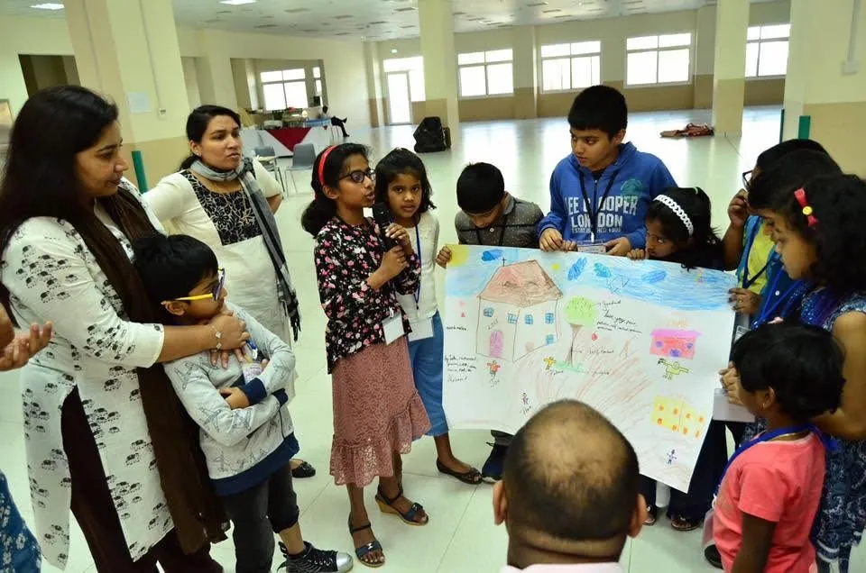 Children presenting a group activity poster at Sunday School